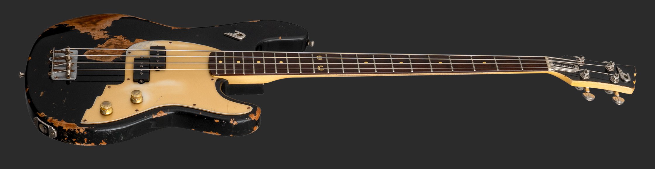 DAC-CC_LAYOUT_05 Product Photo of the Duesenberg Alliance Series Chris Chaney Distressed Black on a dark grey background