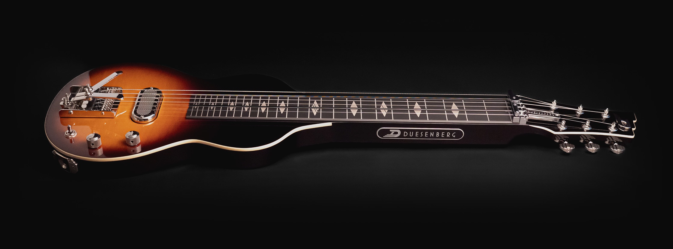 Duesenberg Kalico Lapsteel laying flat on the ground