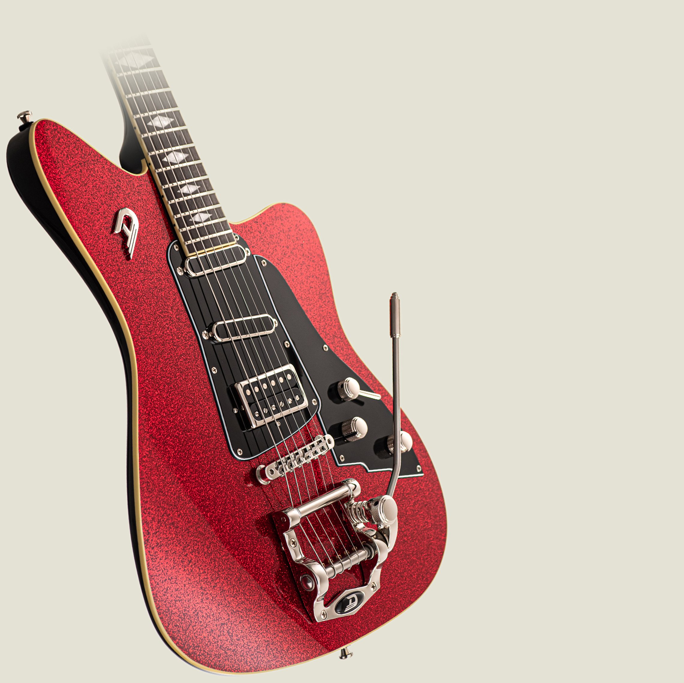 Angled view of the Duesenberg Paloma in RedSparkle on a light background