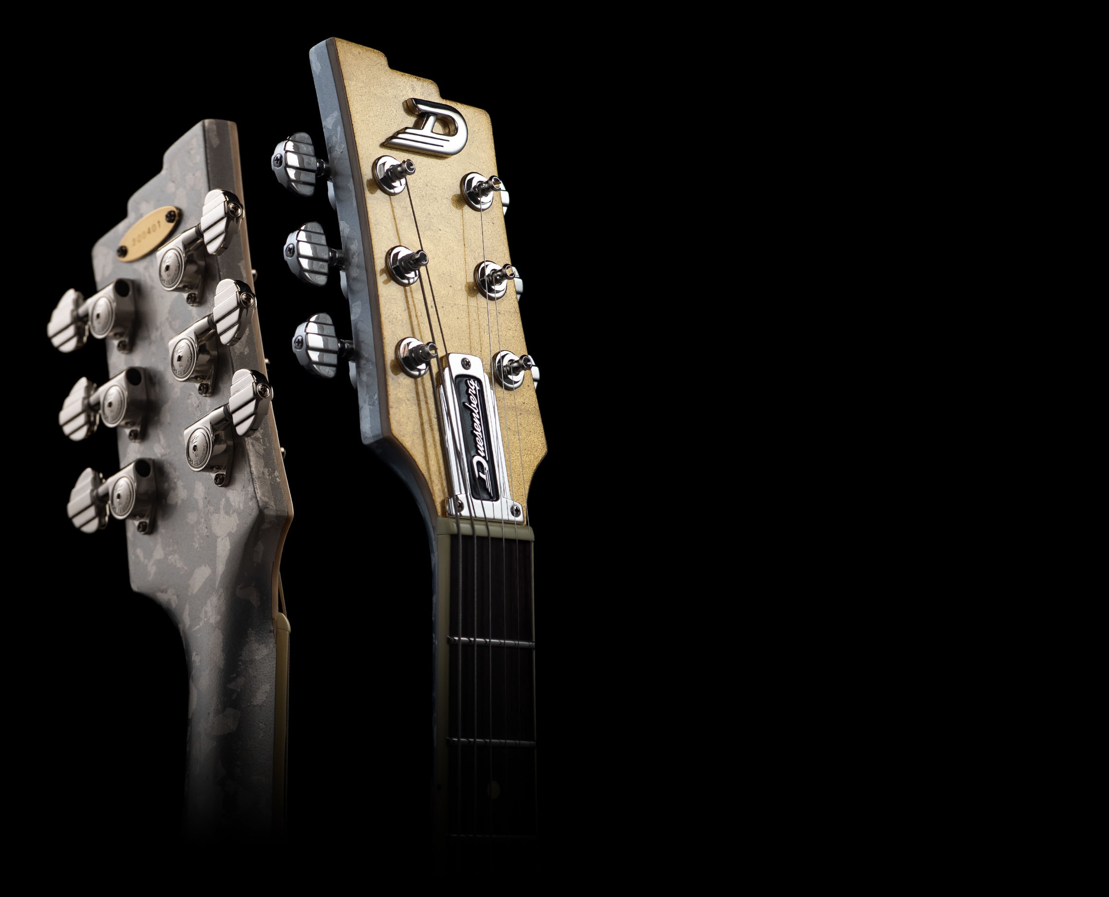 Headstocks, front and back, of the Duesenberg Starplayer TV 25th Anniversary Gold Leaf