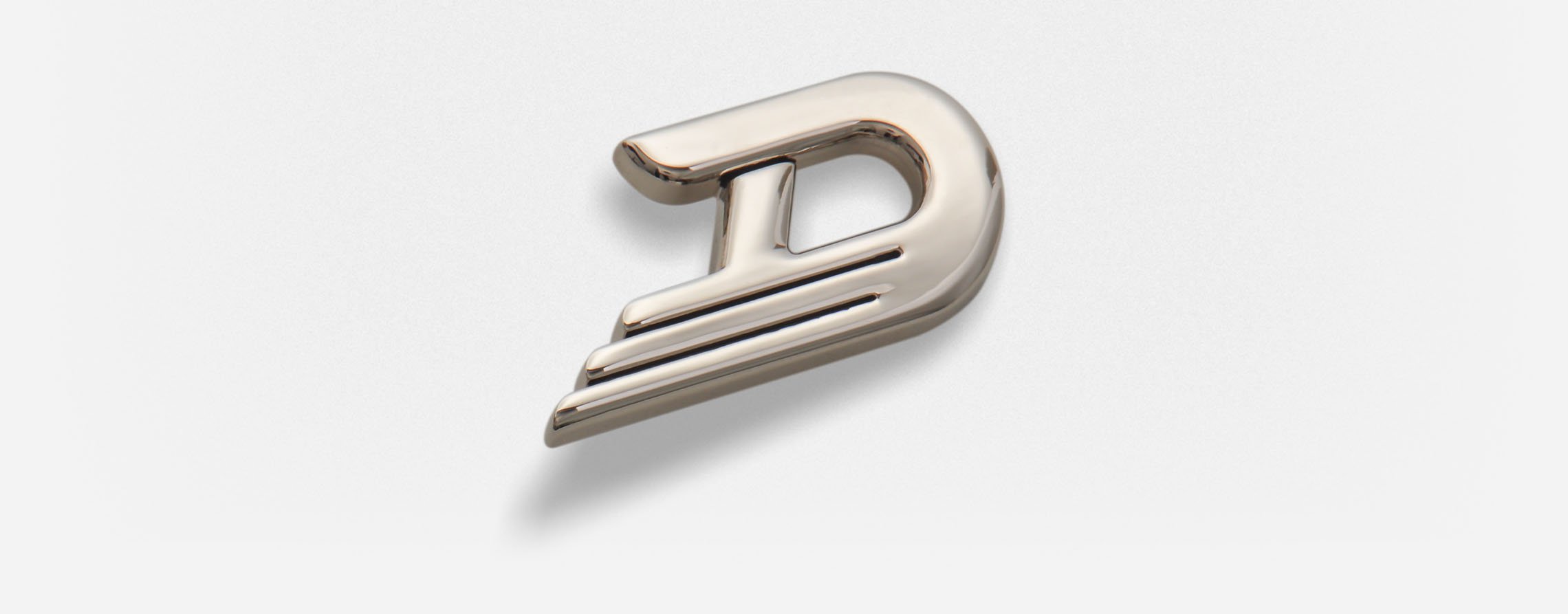 NICKEL-HARDWARE_LAYOUT_01.jpg Duesenberg D-Logo on a light background